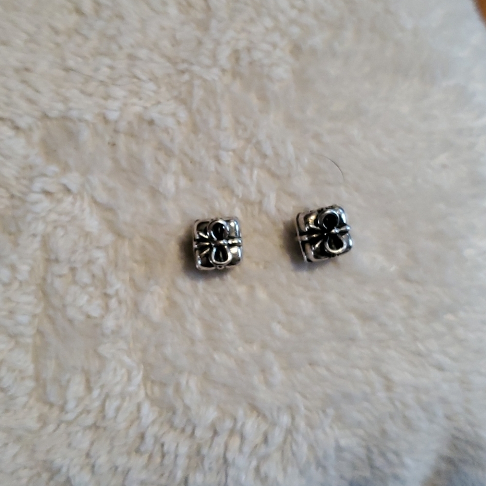 Two Authentic retired Gift charms